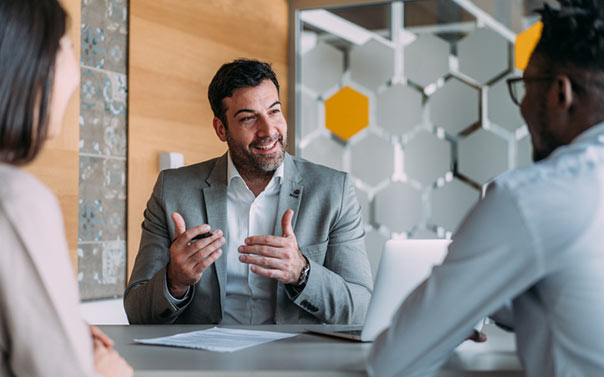 Lawyer talking to two employees